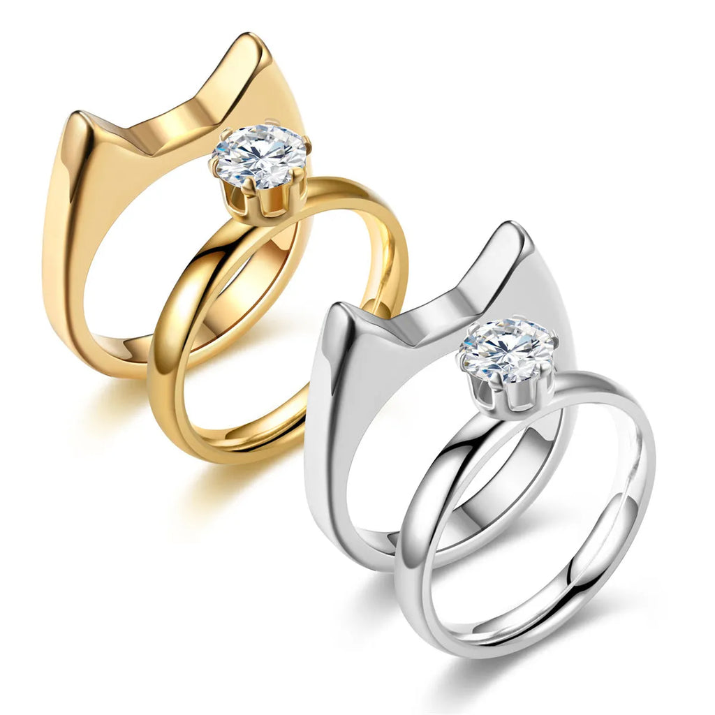 Polished stainless steel cat ear ring in gold finish, side view on white background, size No9
