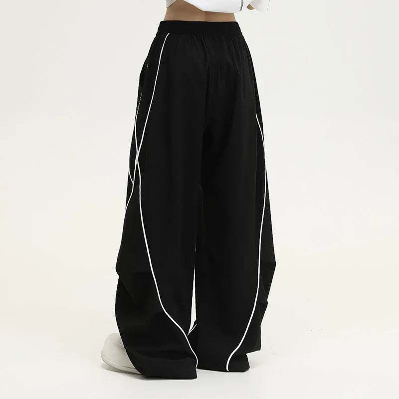 Black striped wide-leg hip hop sports pants with a mid waist and loose fit.