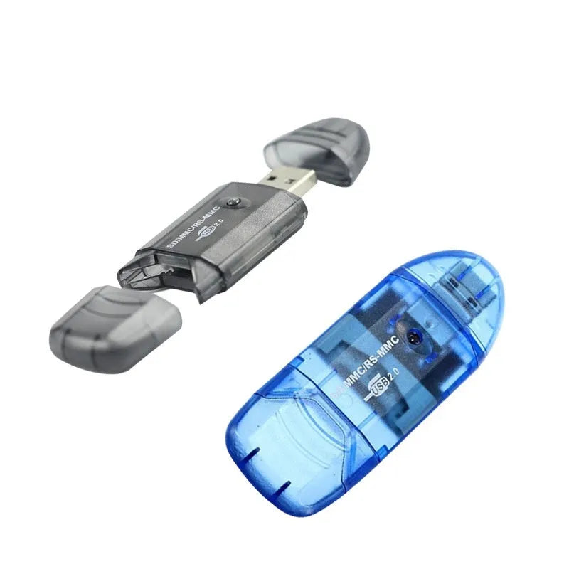Transparent plastic USB card reader with LED light on a desk.