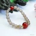 Women's smoky purple agate bracelet with 8mm geometric beads on a white background.