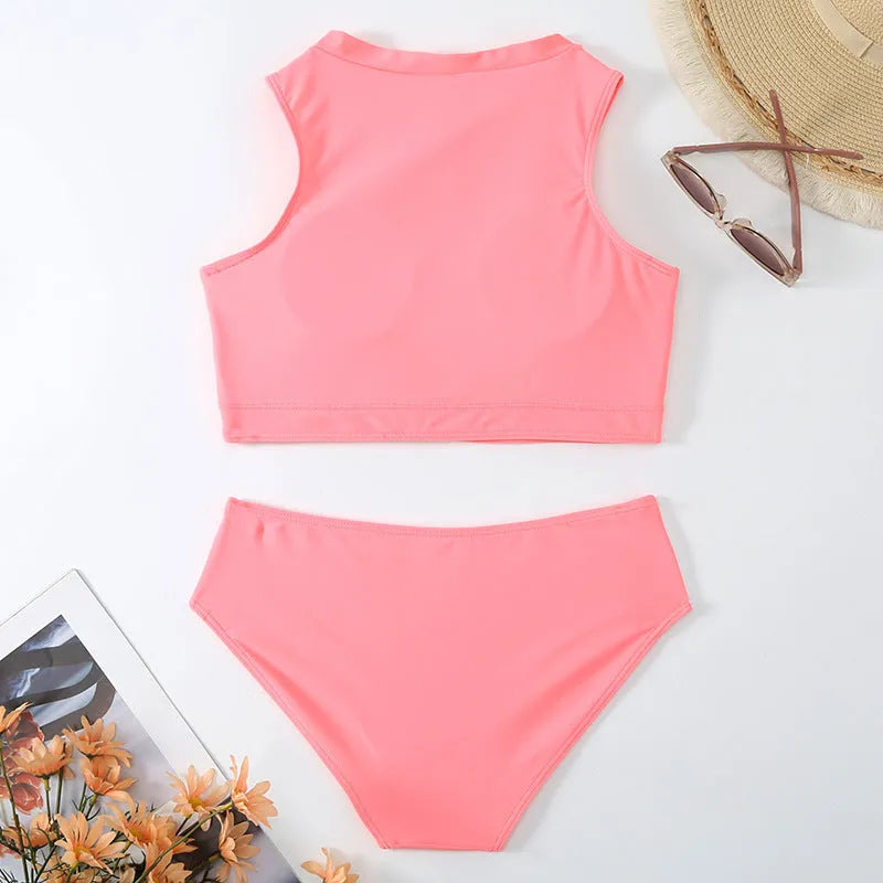Pink high waist split bikini swimsuit set on a model, showing the brief style and sleeveless top.