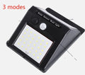 White solar outdoor garden lamp with LED lights and motion sensor for automatic driveway and pathway lighting