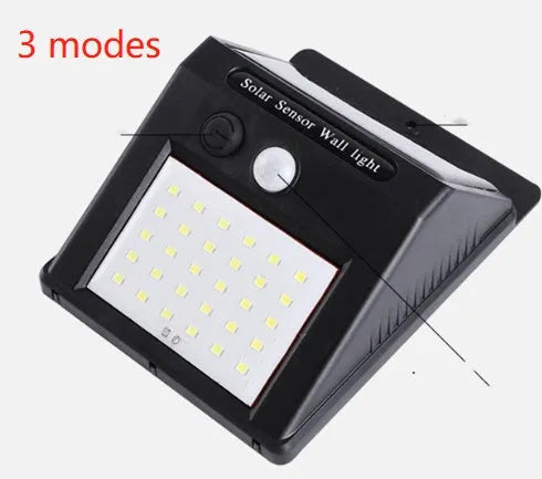 White solar outdoor garden lamp with LED lights and motion sensor for automatic driveway and pathway lighting