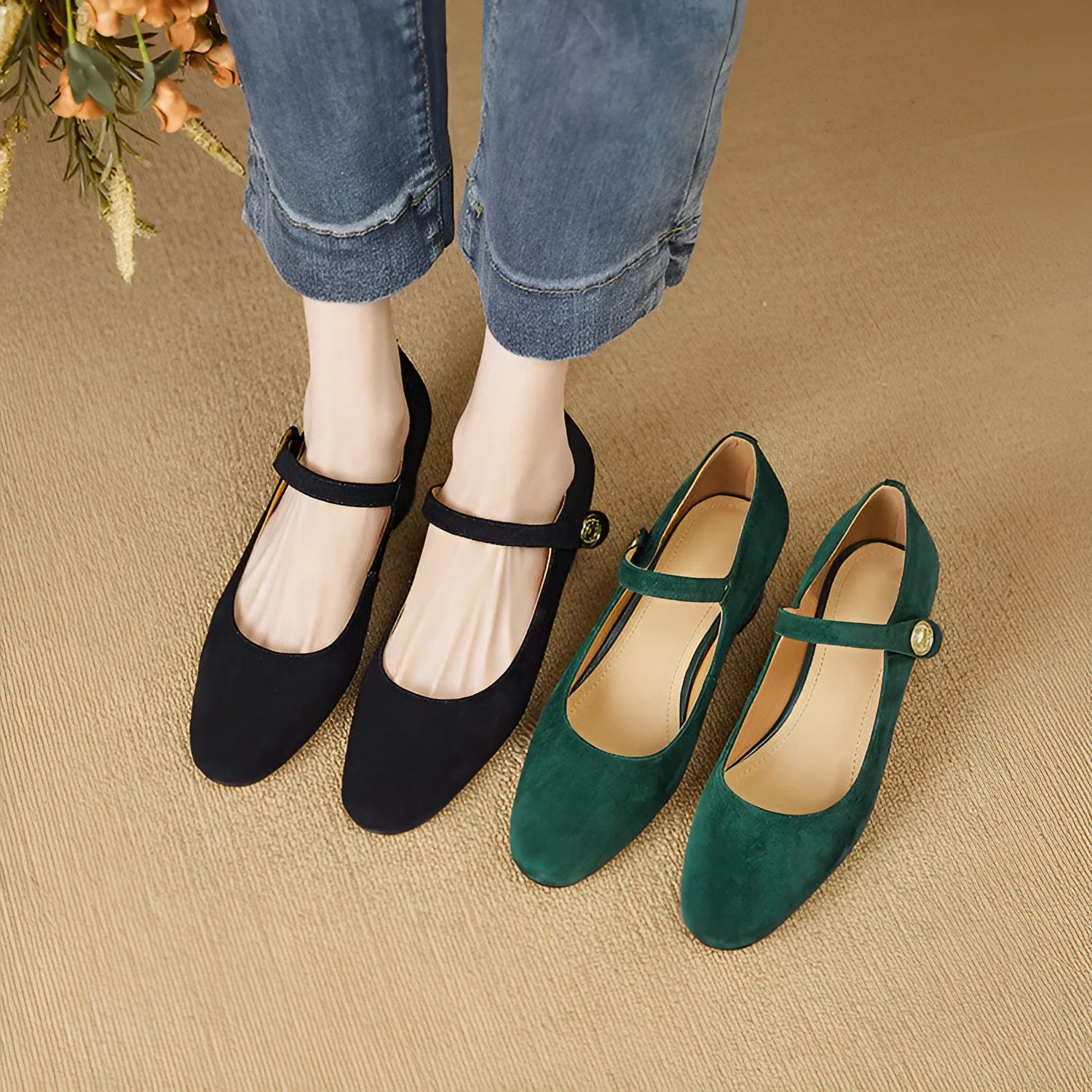 Women's black suede Mary Jane shoes with a chunky heel and square toe on a white background