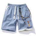 Men's plus size bamboo fibre sports shorts in a loose, high-waisted, straight-leg design on a hanger.