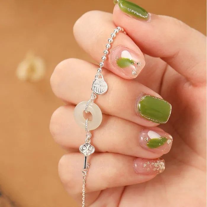 Women's Chinese style Hetian jade bracelet in 925 silver with geometric design and electroplated finish