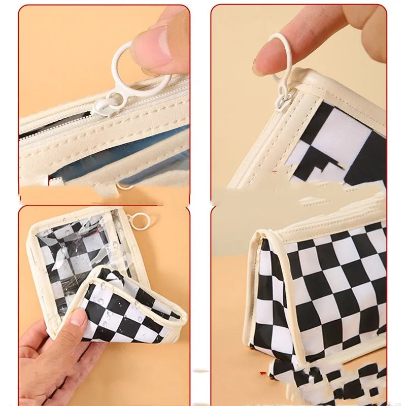 Transparent PVC pencil case with chessboard grid pattern, showing pens inside.