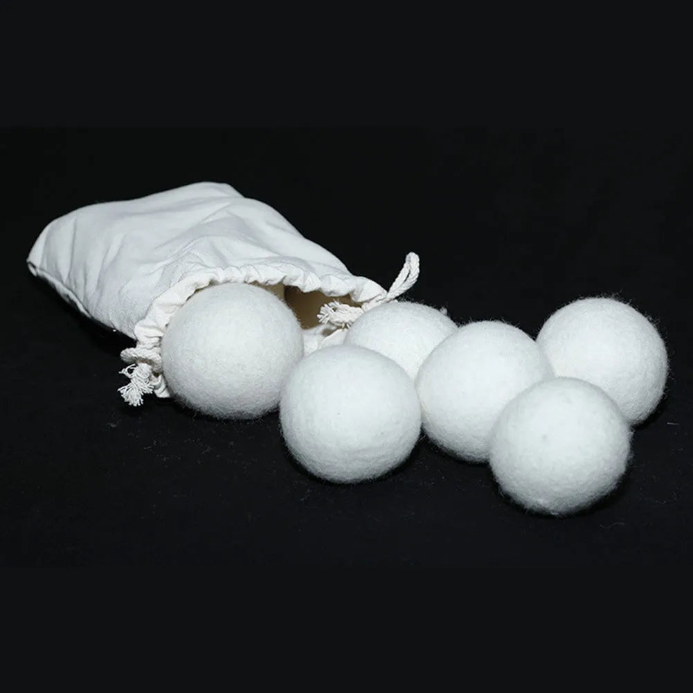 Set of natural wool drying balls with cotton storage bag for laundry static reduction