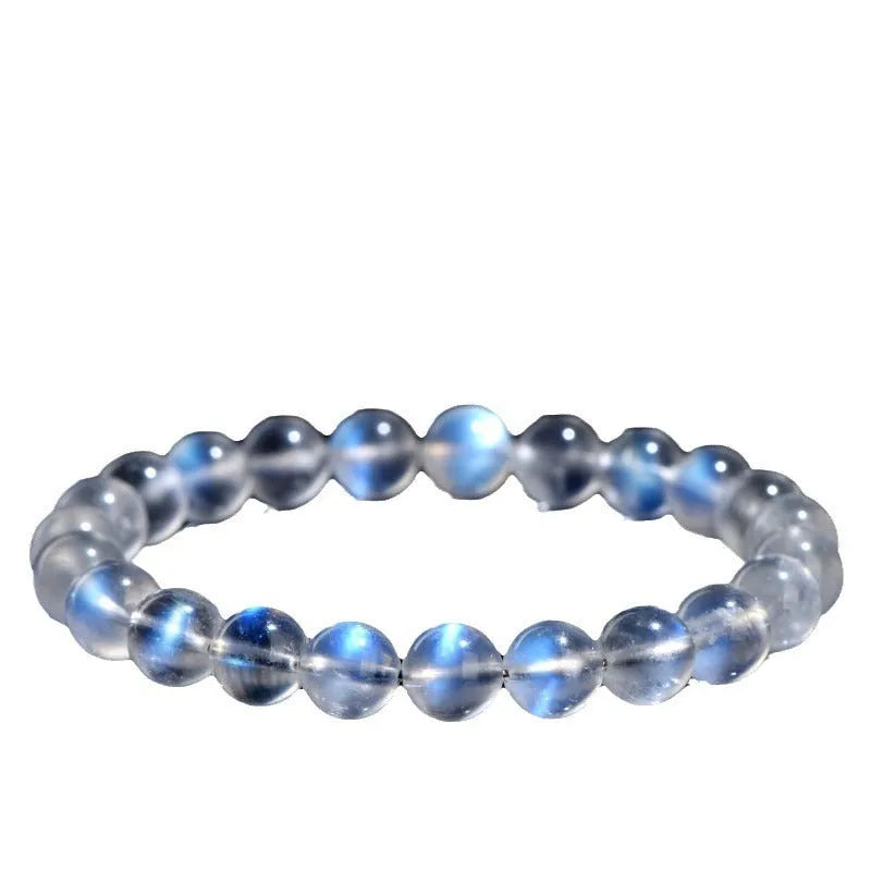 Natural cream body blue moonlight crystal bracelet showing minimalist design on wrist.