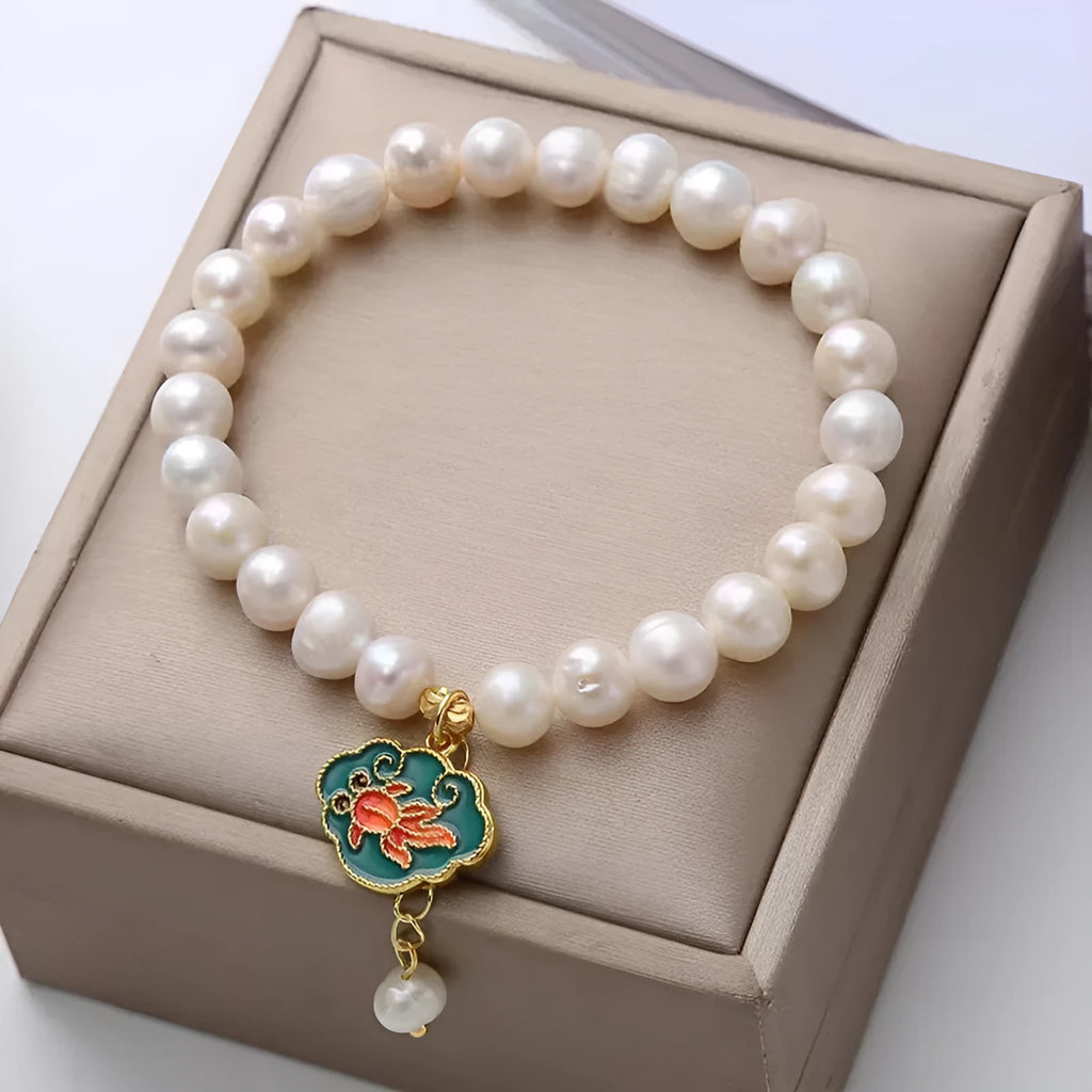 White freshwater pearl bracelet with goldfish pendant and water ripple design in vintage baroque style
