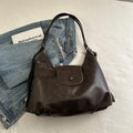 Textured PU leather women's shoulder bag with horizontal square shape and single strap in commuter backpack design