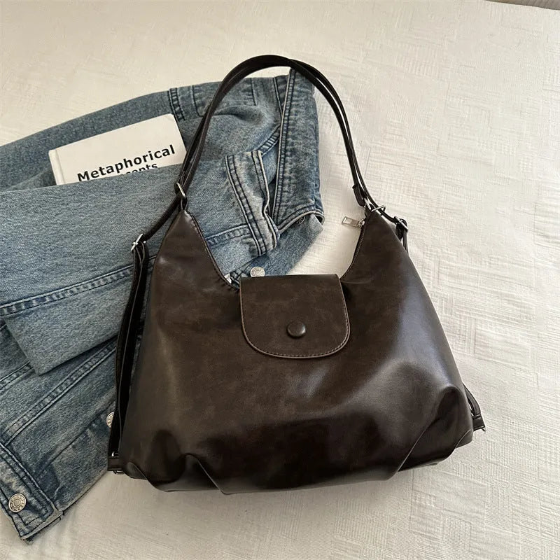 Textured PU leather women's shoulder bag with horizontal square shape and single strap in commuter backpack design