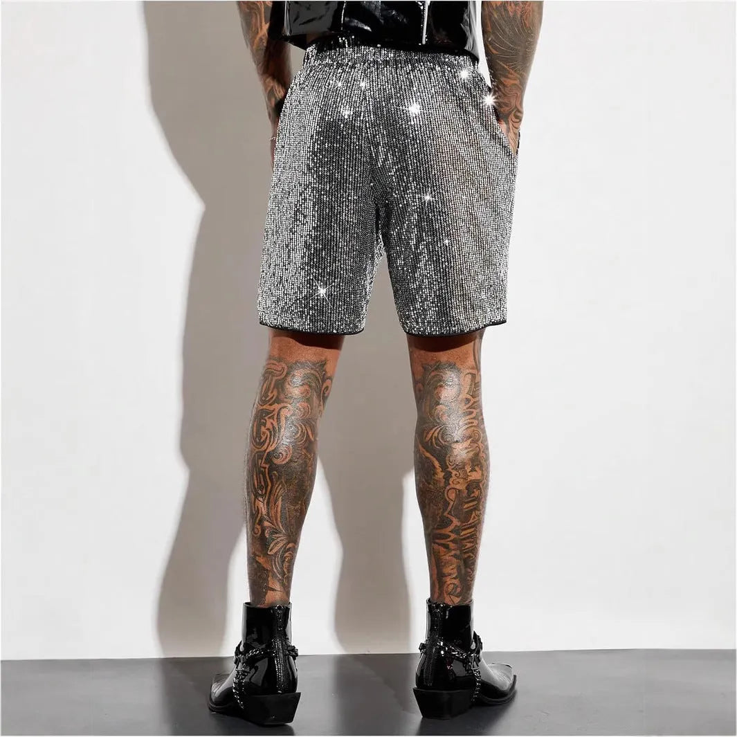 Men's straight-leg shorts with shiny sequins in silver or black, showing elastic waistband.