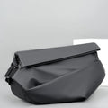 Grey men's crossbody sling backpack made of PU with a zipper and patch pocket.