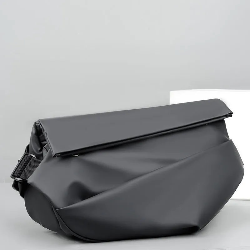 Grey men's crossbody sling backpack made of PU with a zipper and patch pocket.