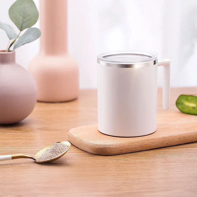 White automatic stirring coffee cup with magnetic base and 360ml capacity shown on a desk.