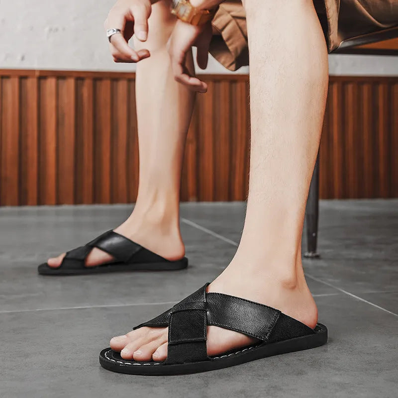Men's black and brown pigskin leather slip-on sandals with a frosted texture and rubber sole.