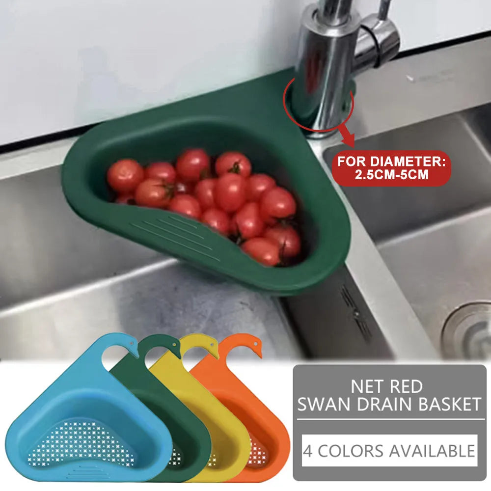 Blue plastic swan-shaped basket hanging over a kitchen sink edge to drain fruit and vegetables.