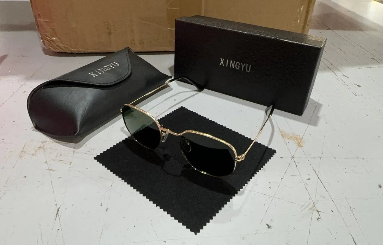 Classic round sunglasses for men in gun grey with polarised UV400 lenses on a case.