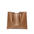 Women's brown genuine leather handbag with multiple internal pockets and single shoulder strap
