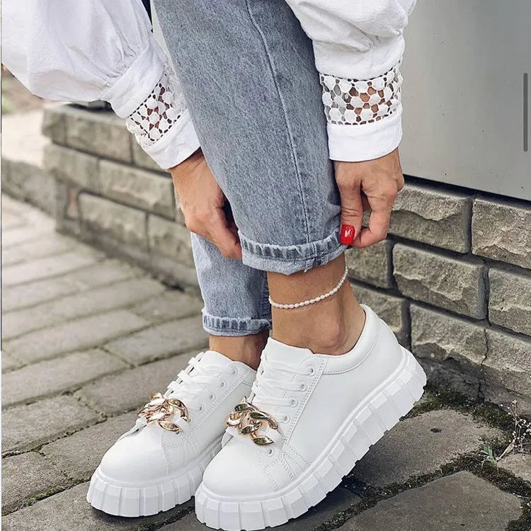 Low-top flat casual sneakers in artificial PU with rubber sole and front lace closure