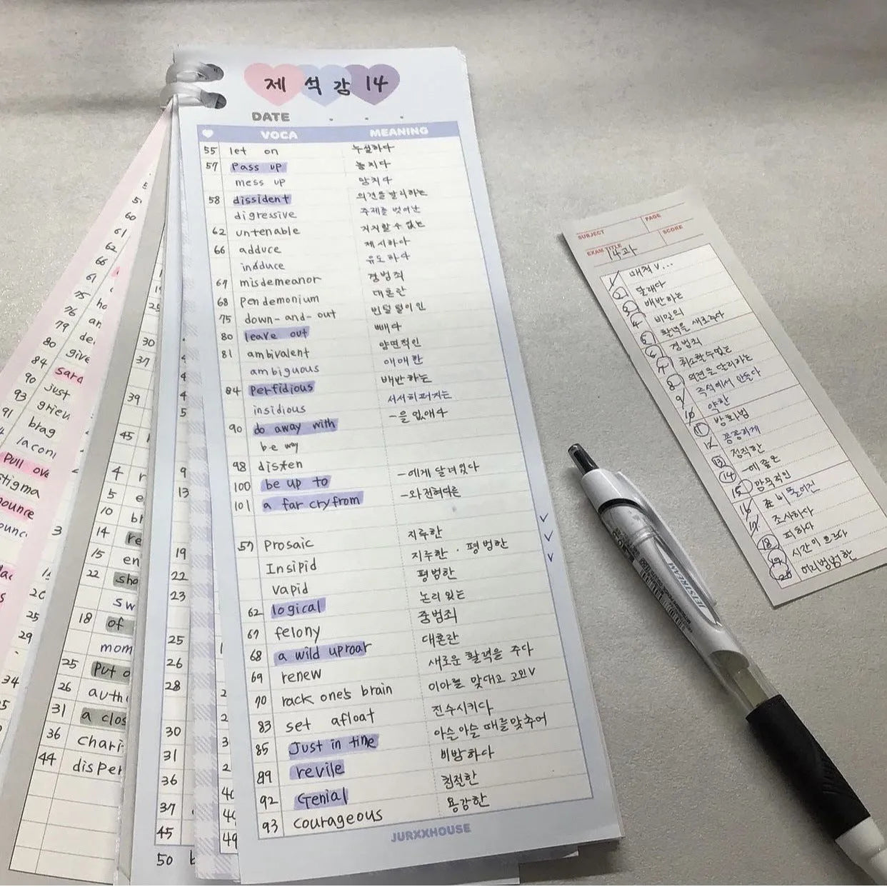 Vertical B5 half-size notepad with English words printed on paper, shown in pink, purple, and blue cover colours.
