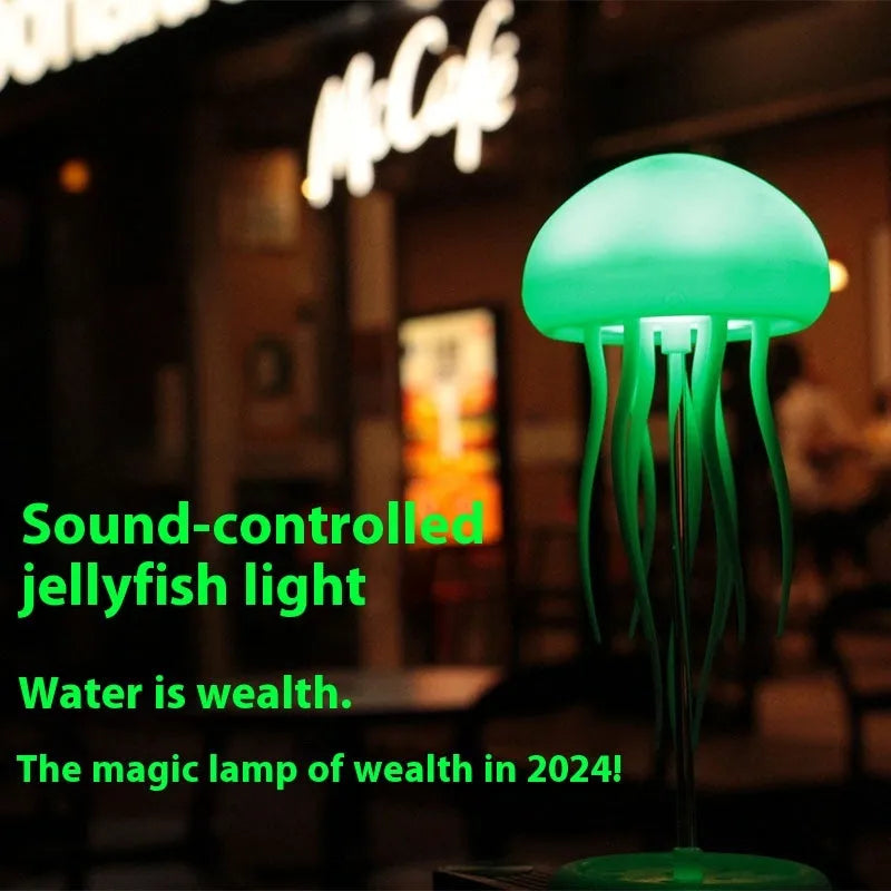 Jellyfish mood lamp with glowing adjustable tentacles on a desk next to a phone.