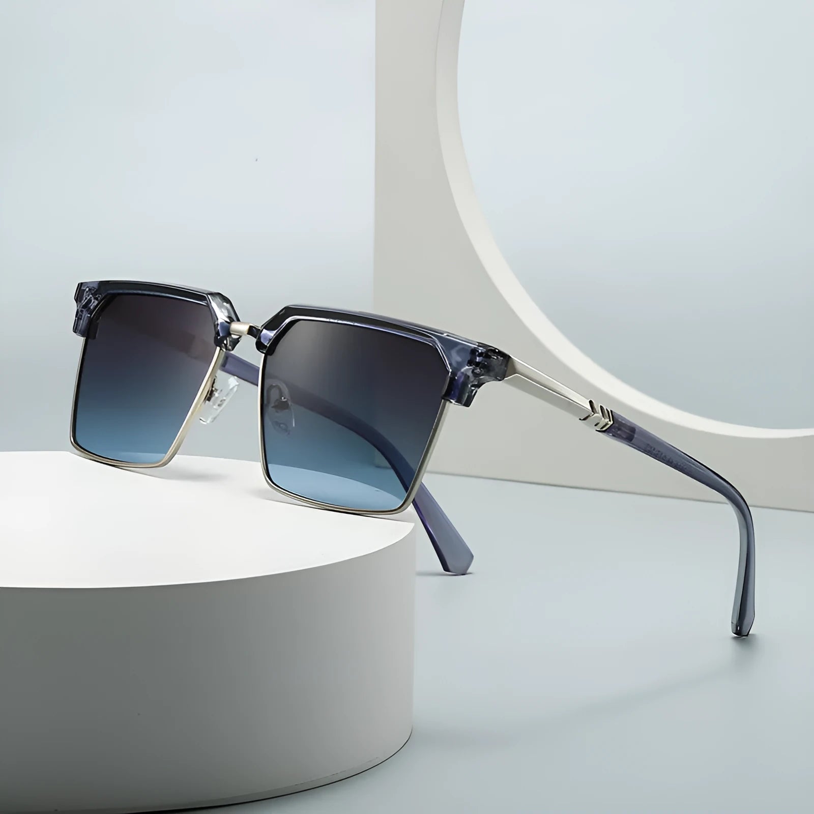 Man wearing black square frame sunglasses with polarised UV400 lenses, showcasing the box style design.
