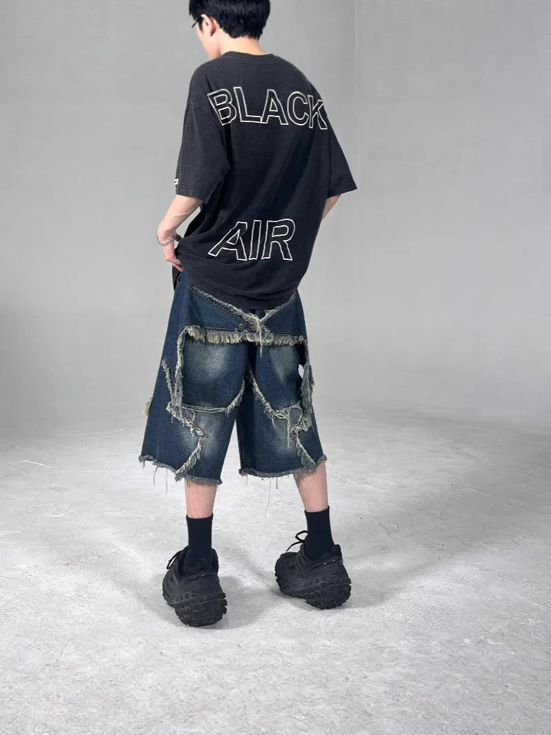 Blue denim shorts with frayed five-pointed star design detail, loose fit cut for summer casual wear