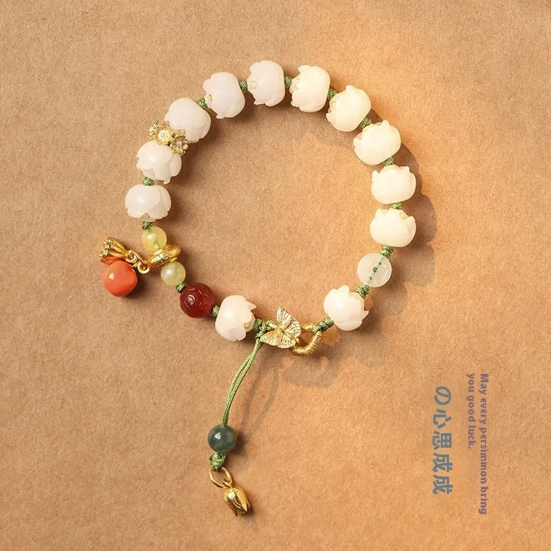 White jade bodhi bracelet with lotus and pumpkin beads on open rope