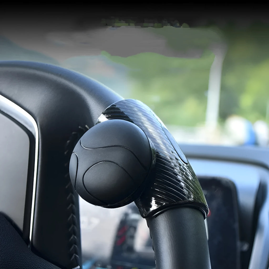 Black silicone steering wheel assist ball for single-handed driving control