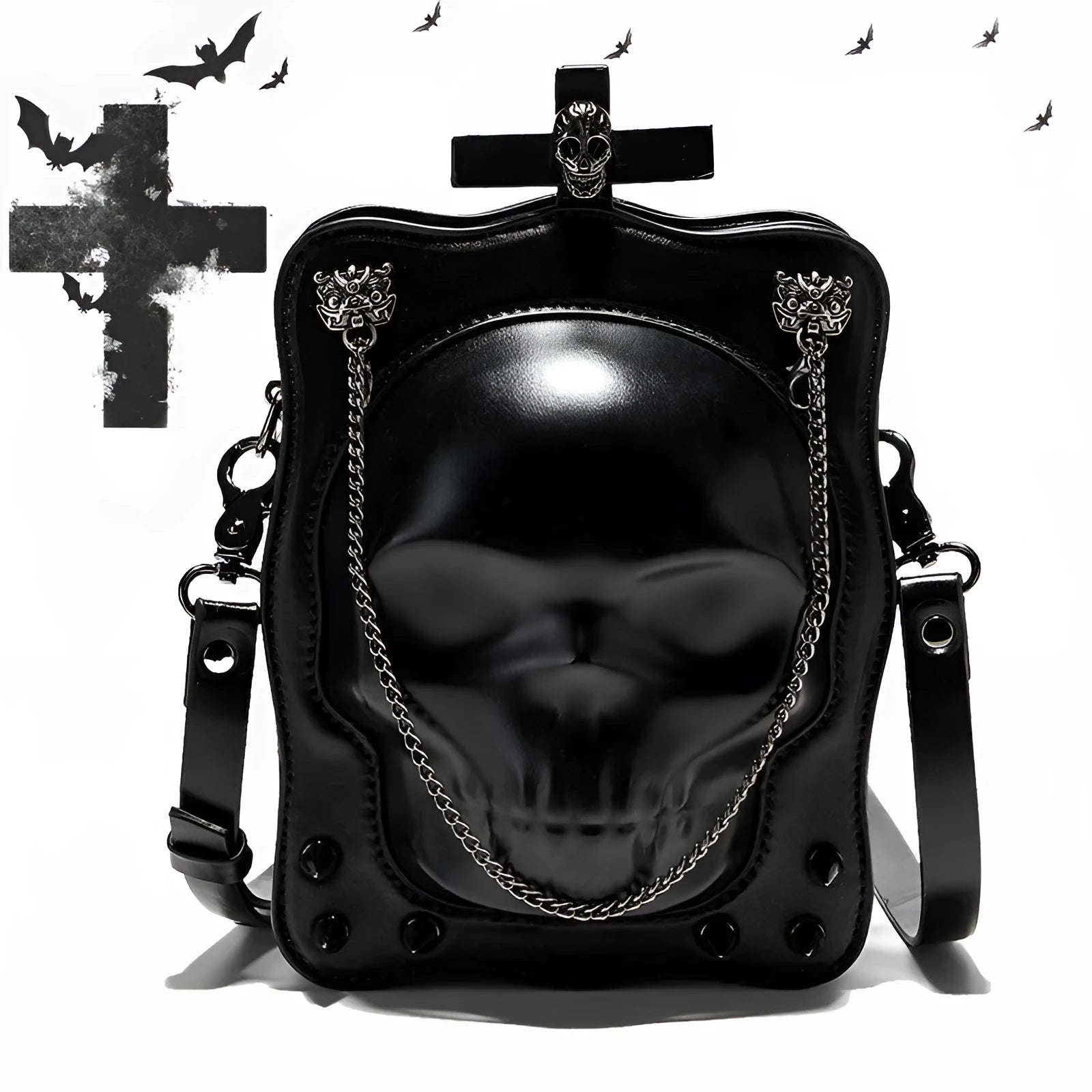 Black mini square crossbody bag with embossed skull design, metal chain strap, and zip closure.