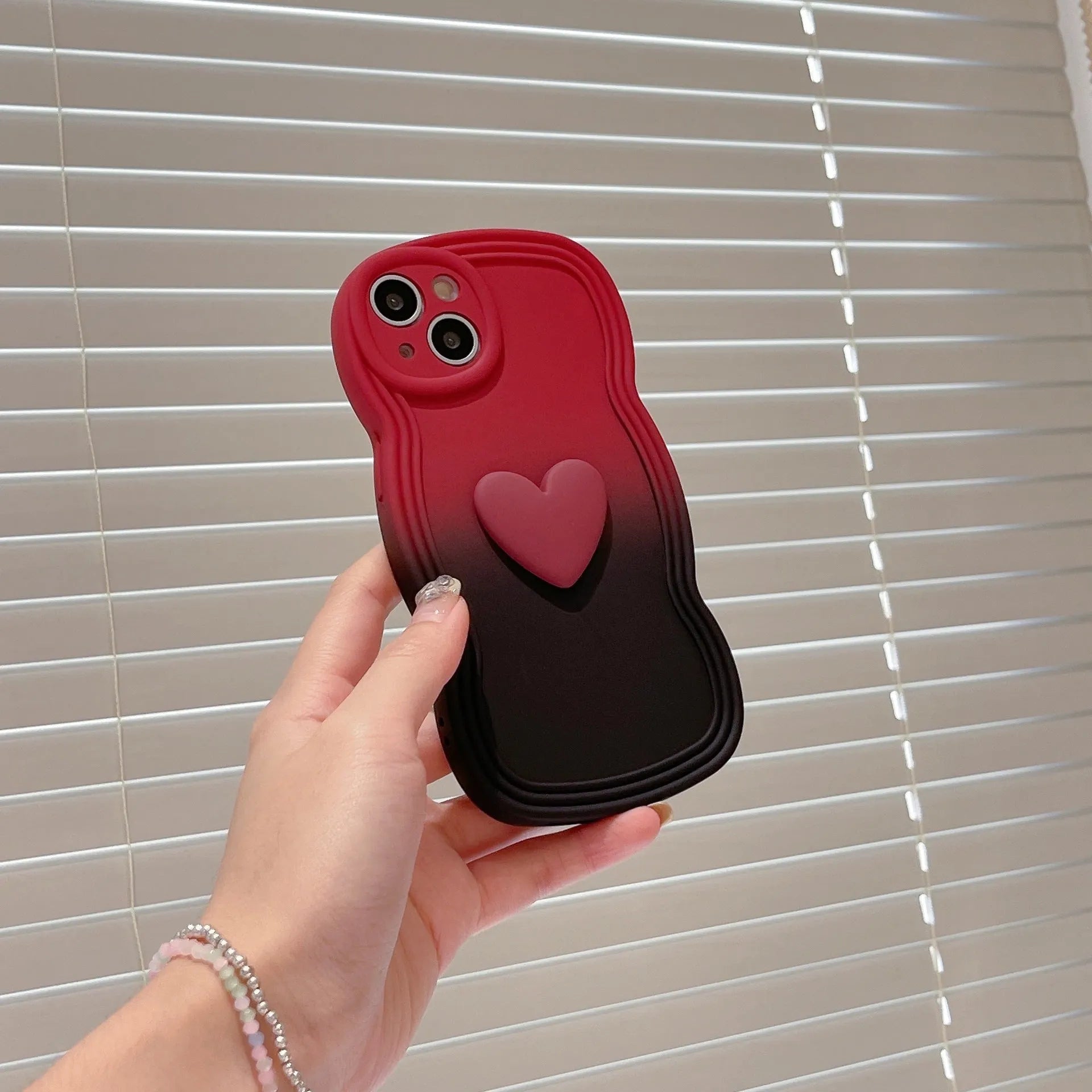 Liquid silicone love heart wavy edge phone case in red gradient black for iPhone 14 Pro Max