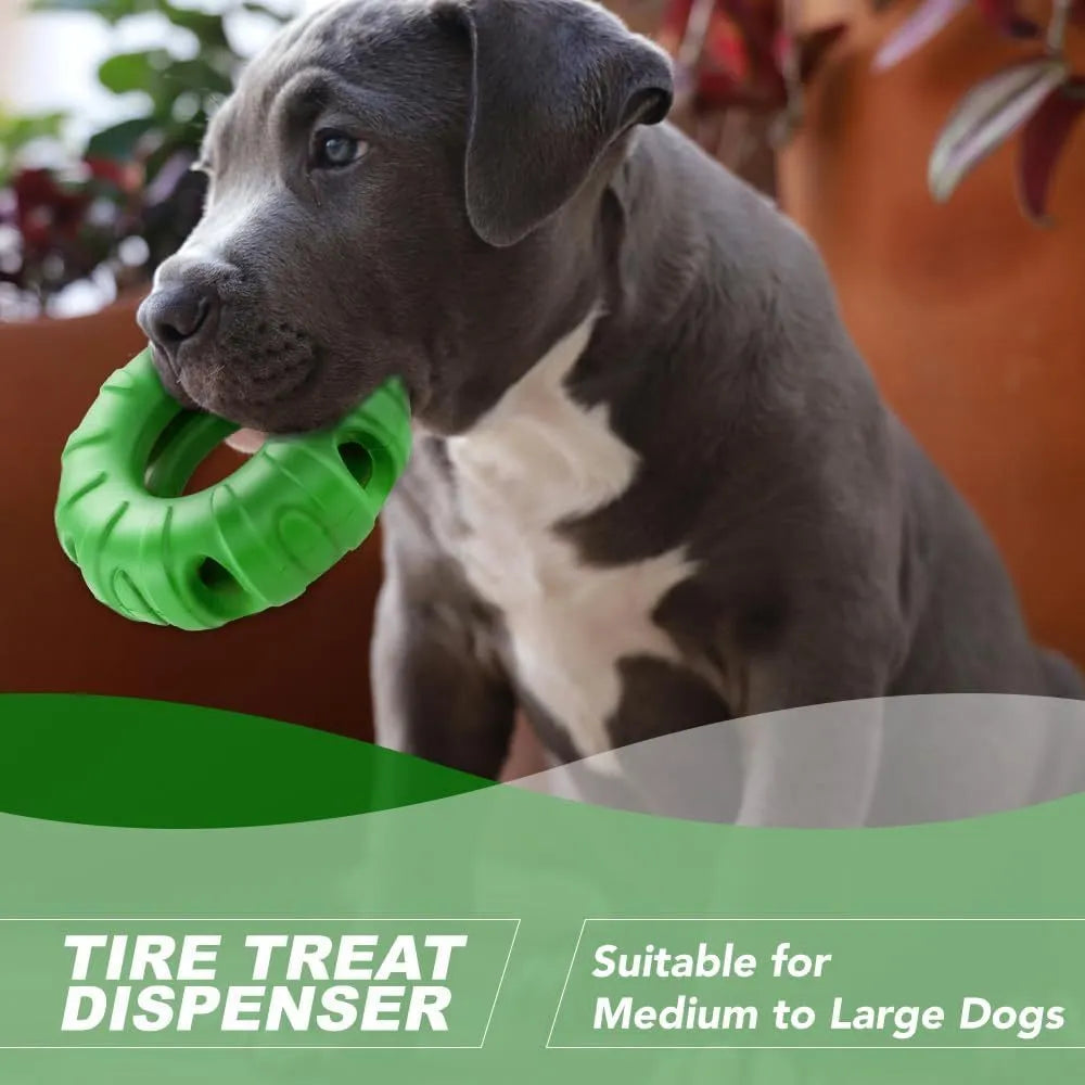 Blue, green, and red natural rubber tyre-shaped dog chew toy with oval openings for treat dispensing.
