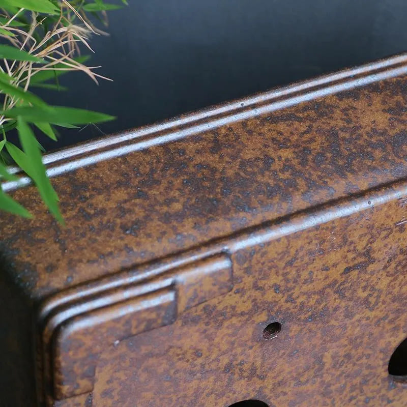 Rectangular unglazed purple sand bonsai pot showing simple design and base with five drainage lines.