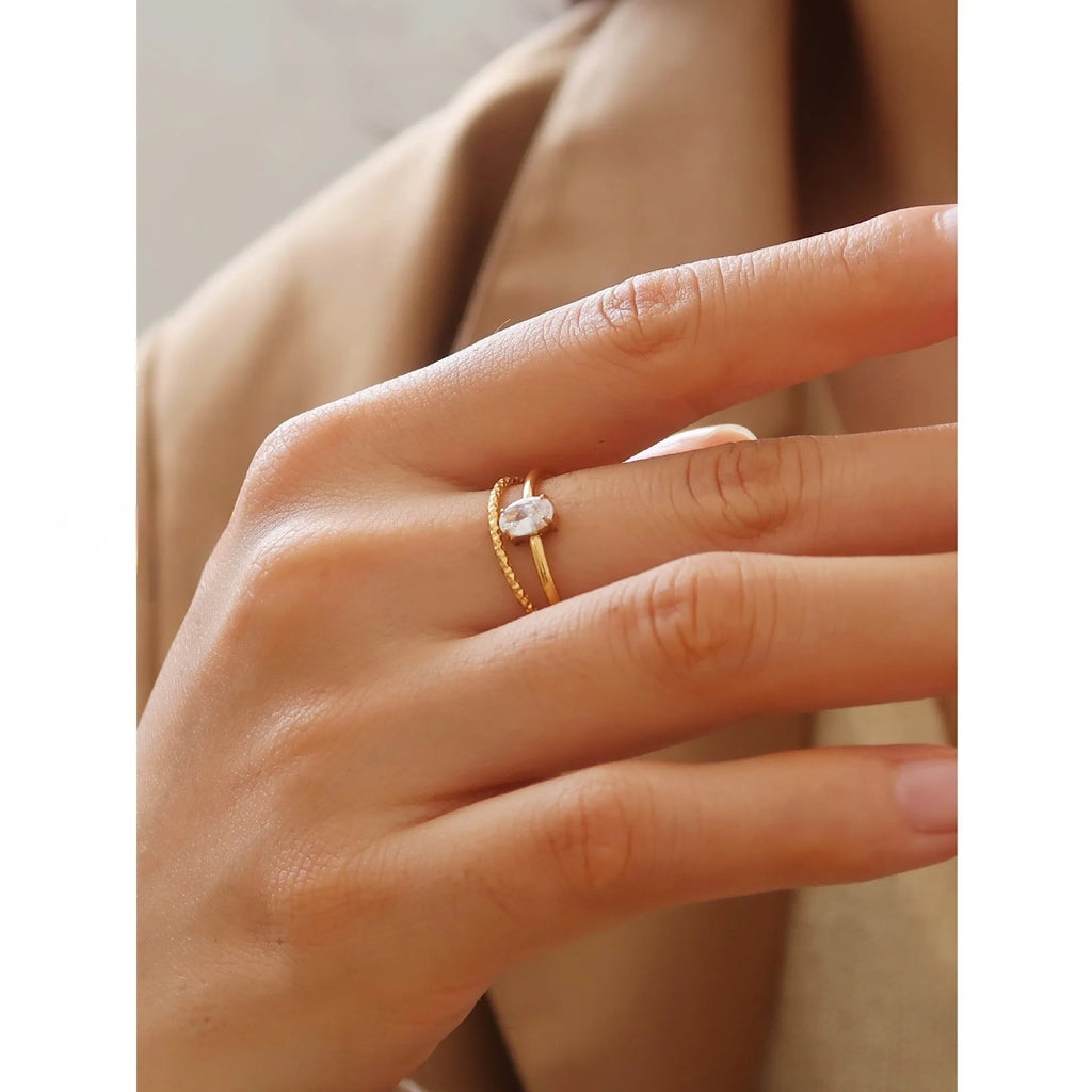 Golden stainless steel simple bracelet with love heart and oval designs showing electroplated surface