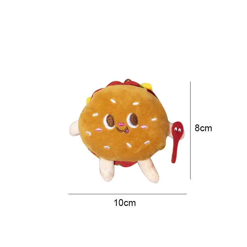 Five cat teething toys shaped like hamburger, chicken leg, fries, hot dog and bread on white background