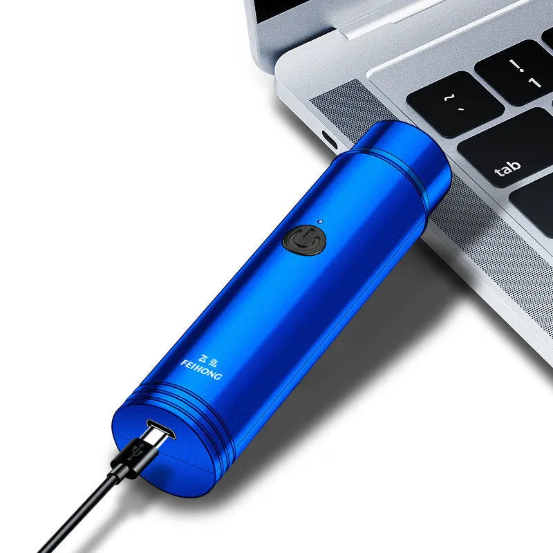 Compact portable electric shaver in black with USB charging cable.