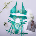 Light green women's embroidered bra and bikini set on a white background