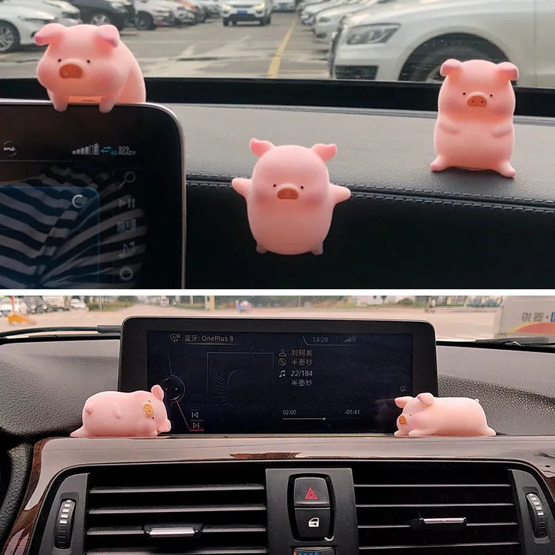 A hard resin cartoon pig car dashboard ornament in one of eight available decorative styles.