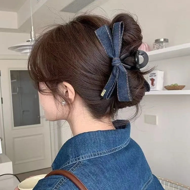 Blue denim bow barrette with cloth bow and metal clip on women back head hair