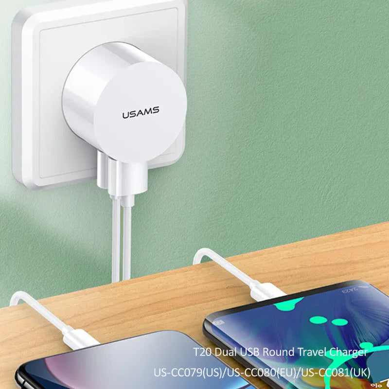 White portable universal dual USB phone charger with foldable US, EU, and UK plugs showing 39mm diameter