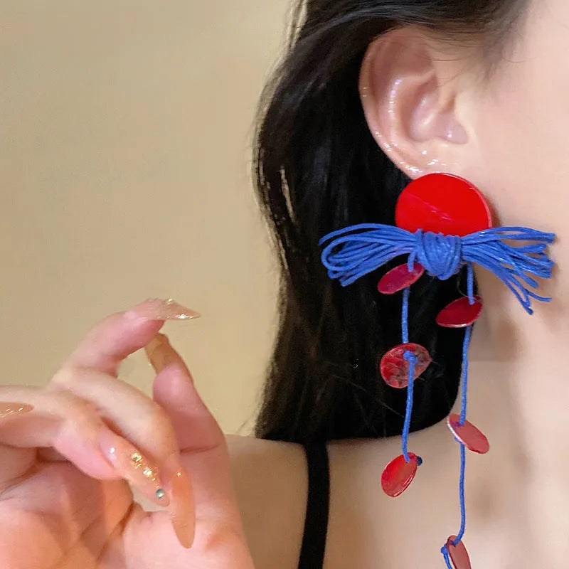 Women's handmade geometric drop earrings with blue resin flower in silver needle colour