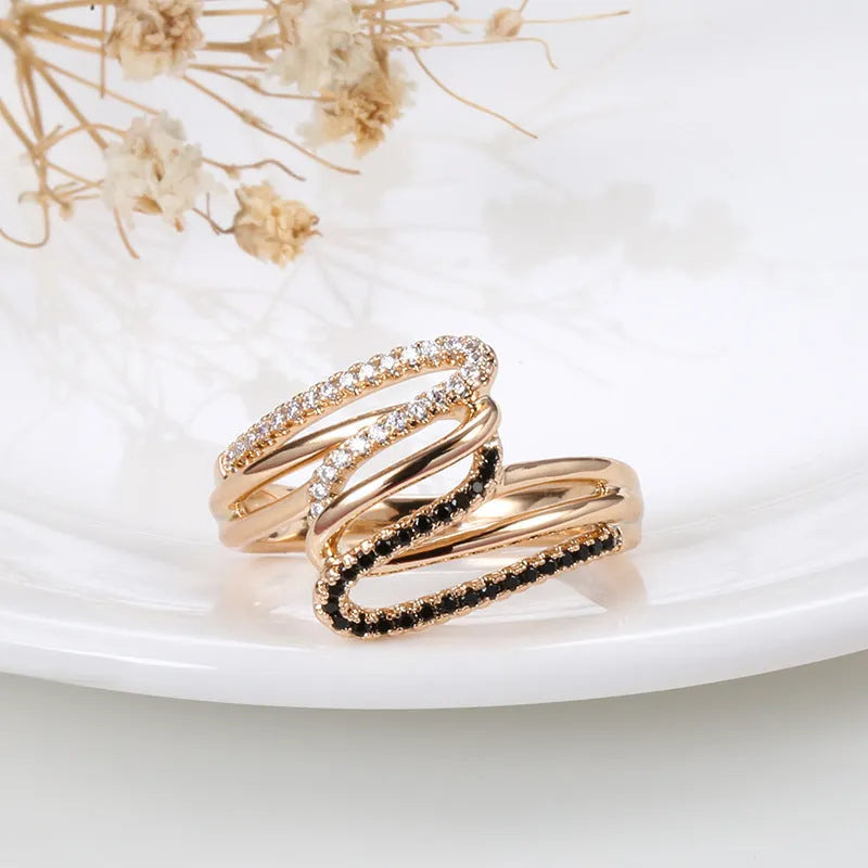 Gold tone women's copper ring with micro-inlaid sparkling zircon stones on a finger.