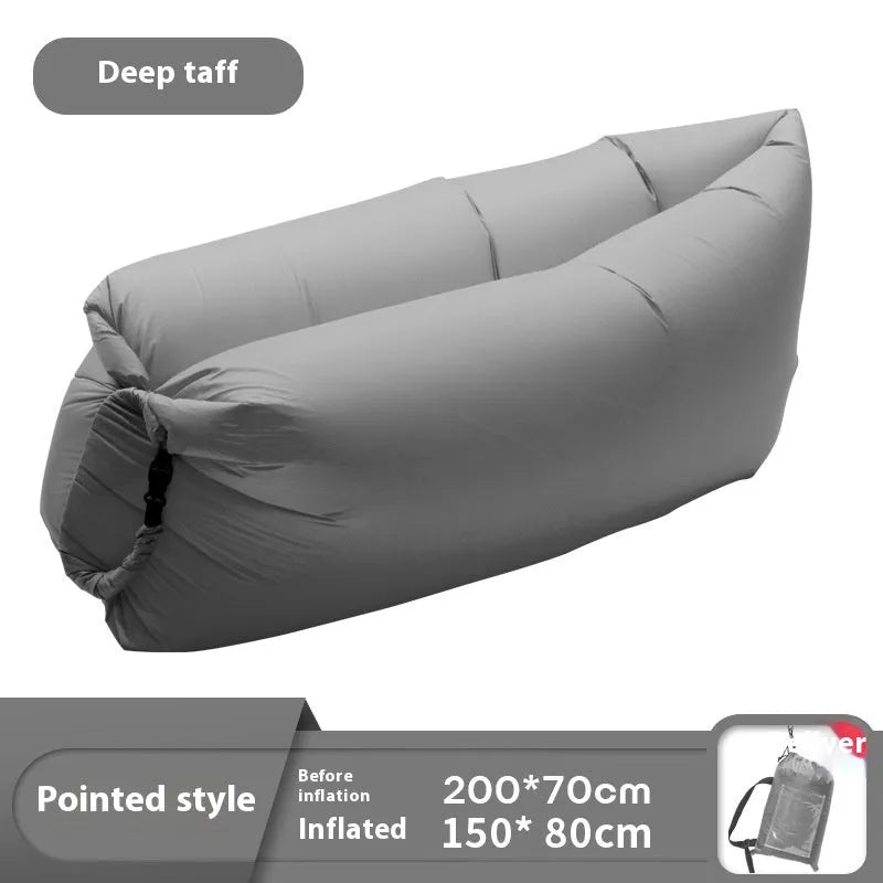 Inflatable lazy sofa in yellow smiling face tip colour, folded for transport with one-minute inflation valve visible