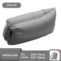 Inflatable lazy sofa in yellow smiling face tip colour, folded for transport with one-minute inflation valve visible