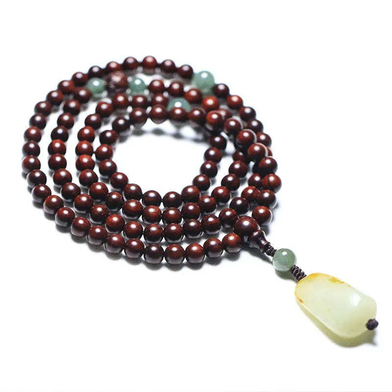 Rosewood bead bracelet with a carved Pterocarpus Santalinus and Hotian Jade stone pendant.