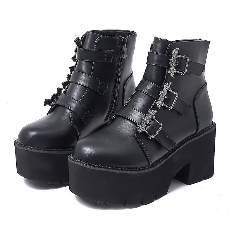 Black women's punk platform ankle boots with bat buckle and side zip.