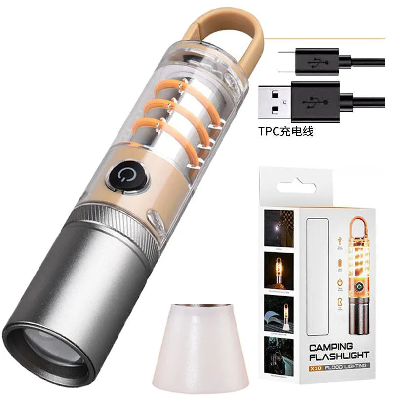 Orange 10W LED torch with optical zoom lens and keychain, shown with USB charging cable.