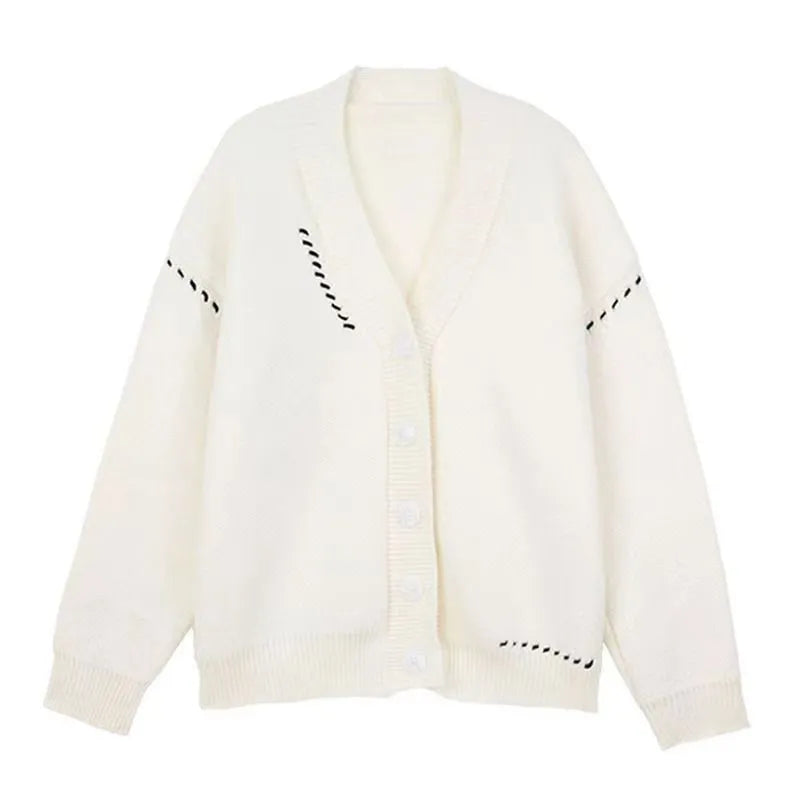 Women's loose black knitted cardigan coat with long sleeves on a hanger